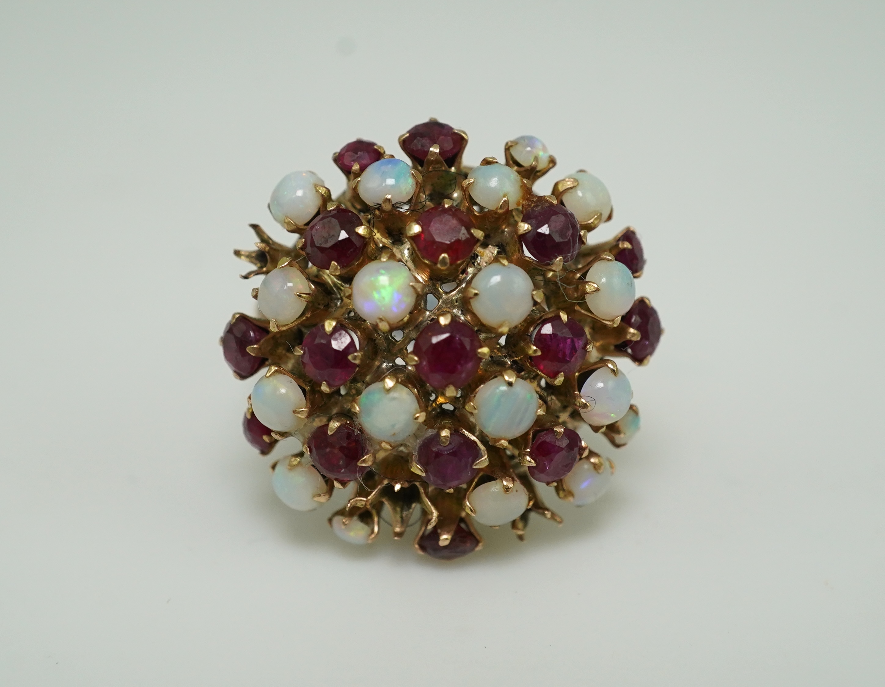 A ruby and opal cocktail ring, mid 20th century
